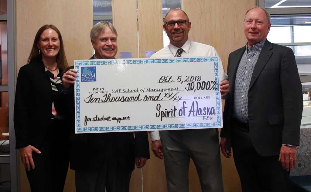 Anthony Rizk presenting check for $10,000 to UAF School of Management on October 5th, 2018