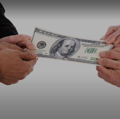 two people tugging on a $100 bill